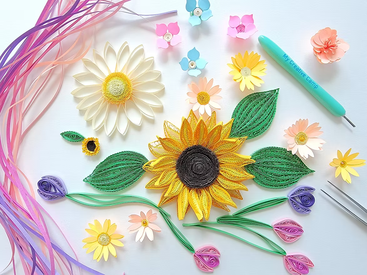 Colorful paper quilling flowers made with rolled paper strips