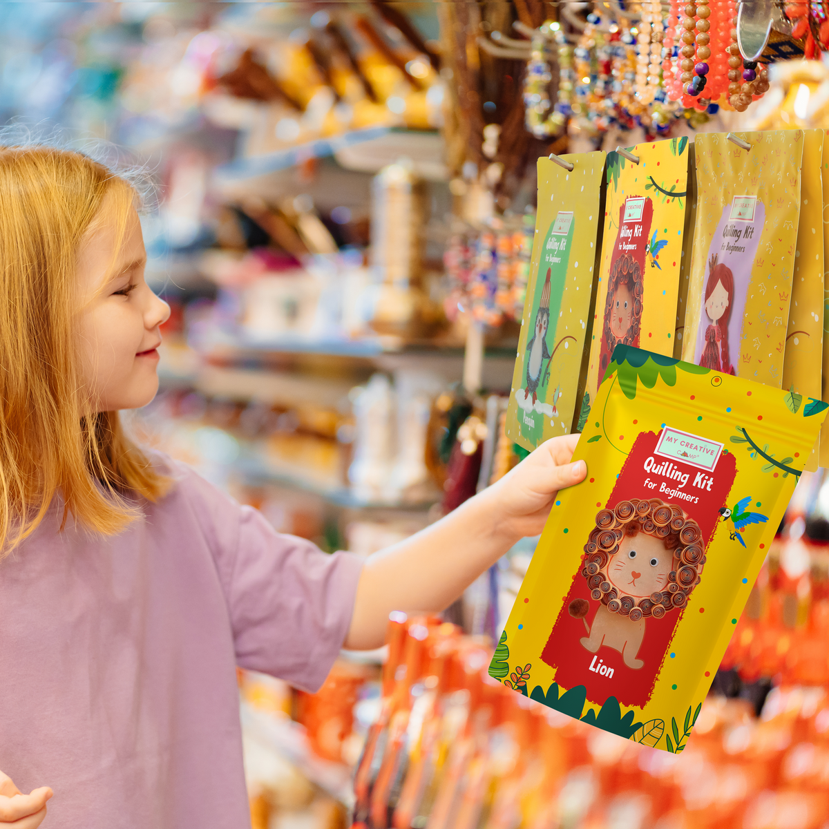 Child holding a lion paper quilling kit designed for beginner crafting projects