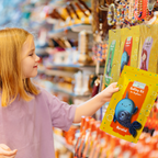 Child holding a craft kit package with a blurred store background
Narwhal paper quilling kit shown as a creative gift for kids and craft lovers