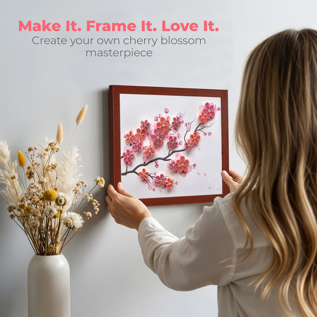 Person holding a framed cherry blossom artwork with text 'Make It. Frame It. Love It.' Child Flower Cherry
