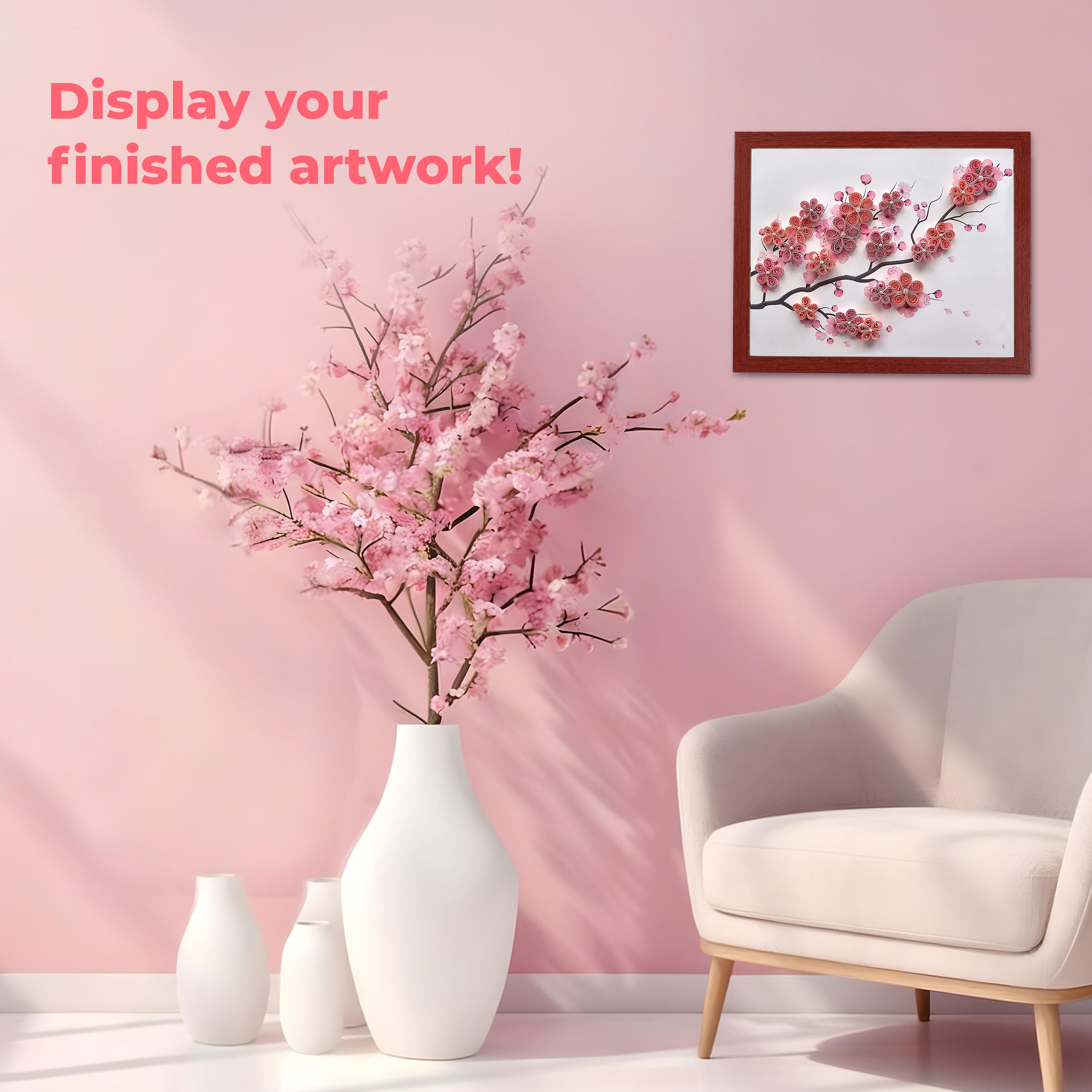 Living room with cherry blossom branches in a vase, framed artwork on the wall, and a white armchair. Display your finished artwork