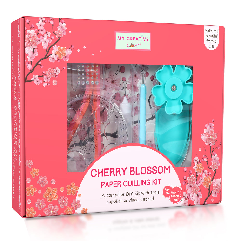 Framed cherry blossom quilling artwork displayed on a minimal table with soft neutral background