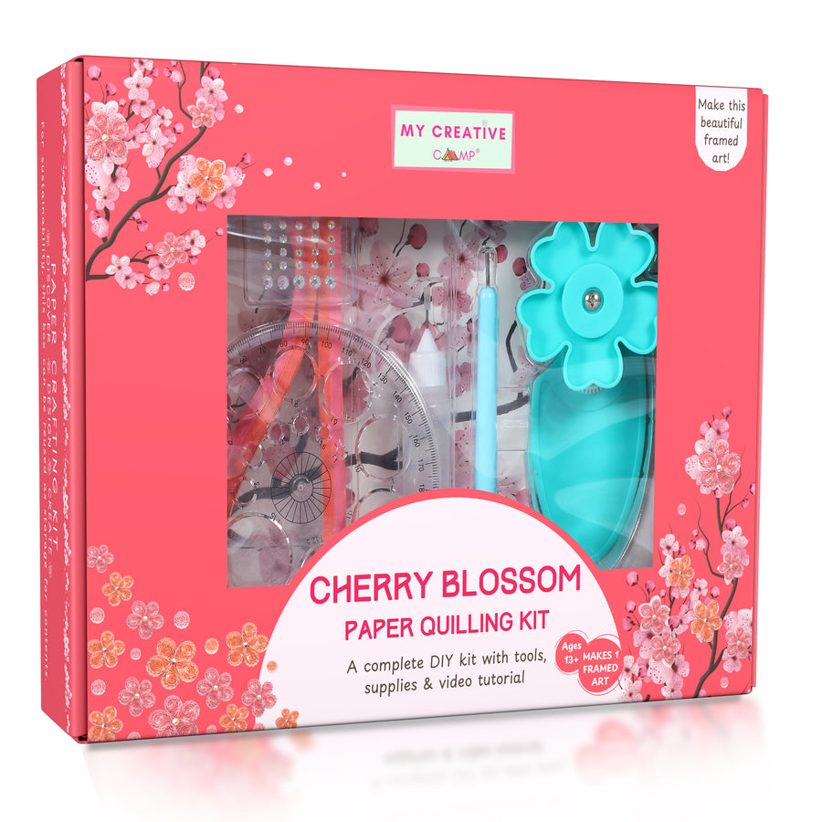 Framed cherry blossom quilling artwork displayed on a minimal table with soft neutral background