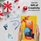 Quilling kit for beginners with a narwhal design, surrounded by Christmas decorations on a white background.
Calming paper quilling activity creating a cute narwhal design for intermediate crafters events