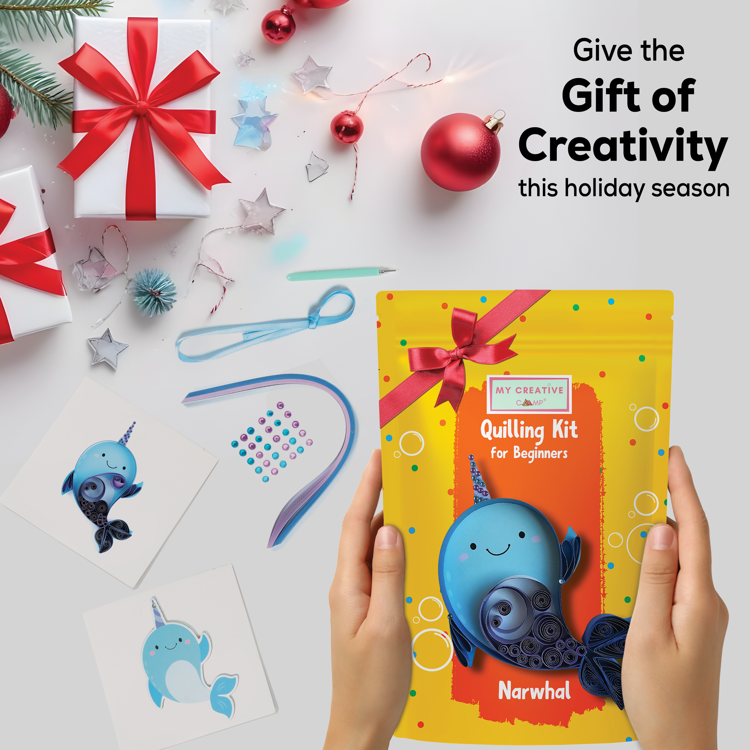 Quilling kit for beginners with a narwhal design, surrounded by Christmas decorations on a white background.
Calming paper quilling activity creating a cute narwhal design for intermediate crafters events