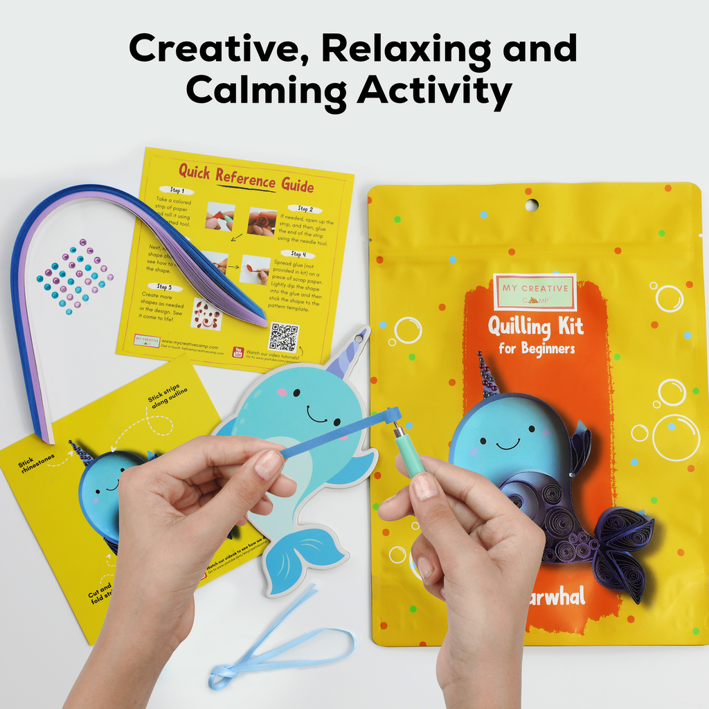 Quilling kit with whale design, reference guide, and text 'Creative, Relaxing and Calming Activity' on a white background.
Paper quilling kit with narwhal design, quilling tool, colorful paper strips, and accessories