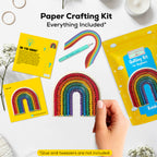 Paper crafting kit with rainbow designs and instructions on a white surface.