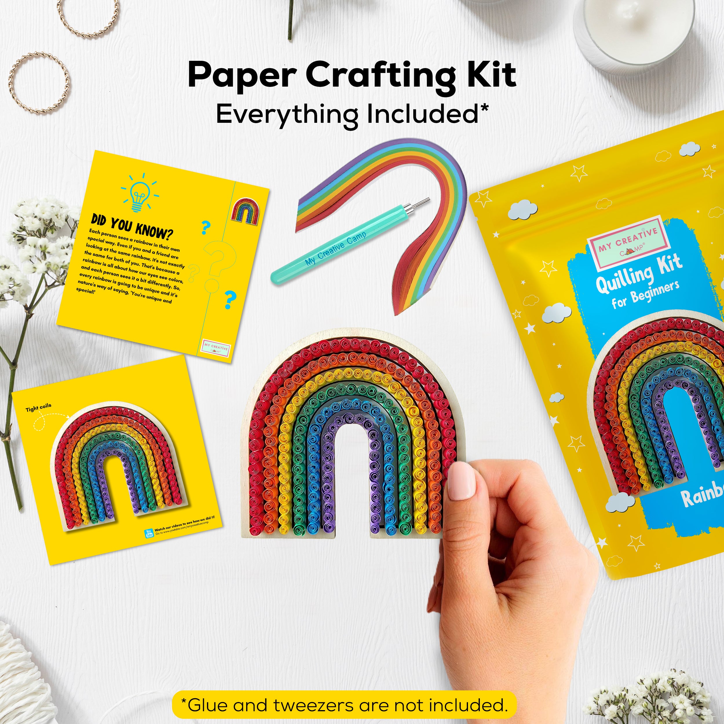 Paper crafting kit with rainbow designs and instructions on a white surface.