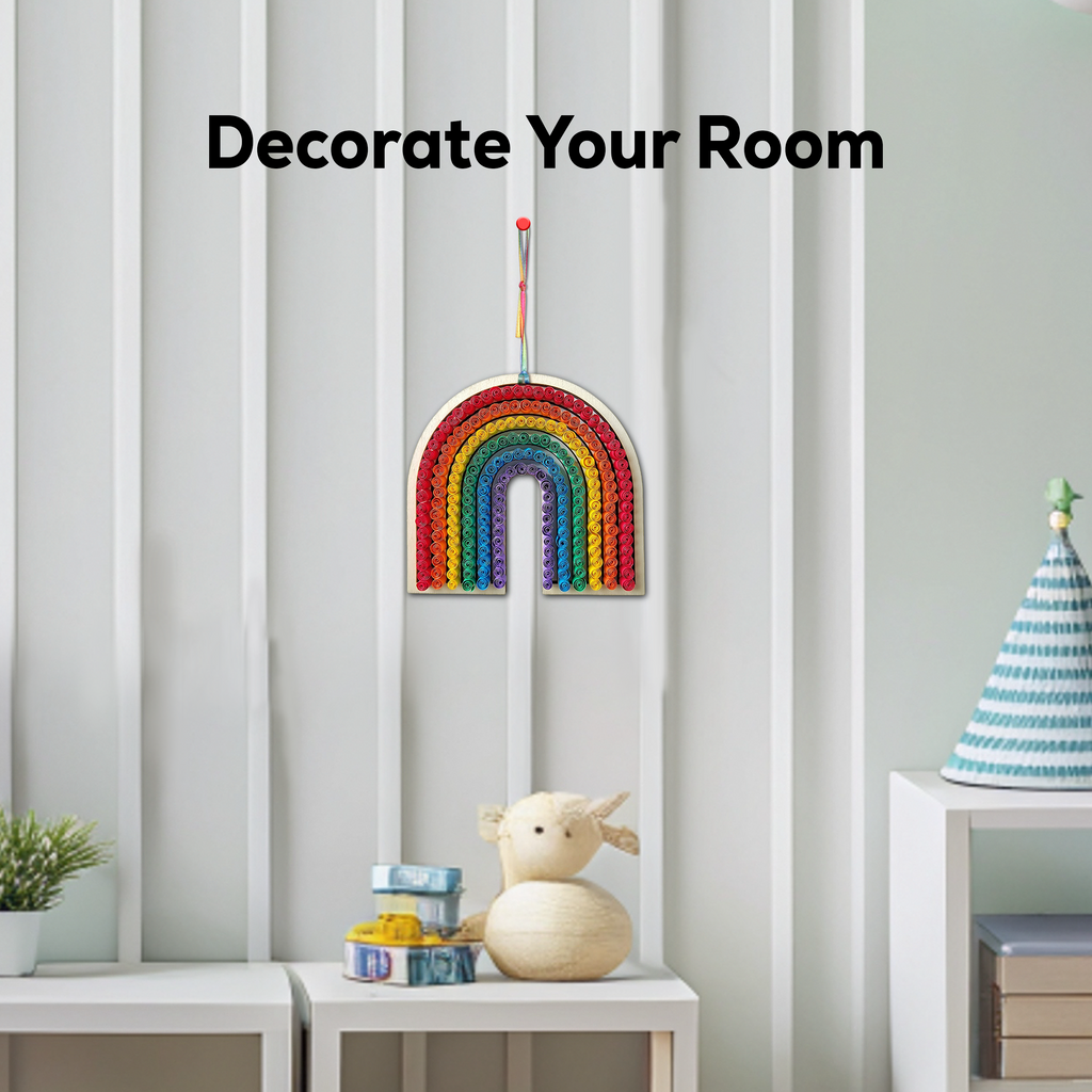 Decorative rainbow wall hanging on a light gray wall with text 'Decorate Your Room'.
Rainbow paper quilling artwork used as colorful wall decor in a child’s room