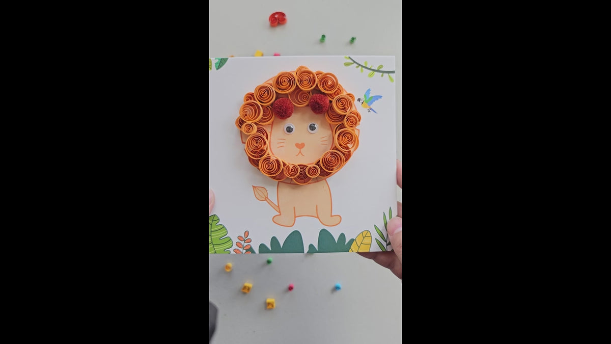 Hands creating a lion paper quilling artwork using an intermediate DIY craft kit