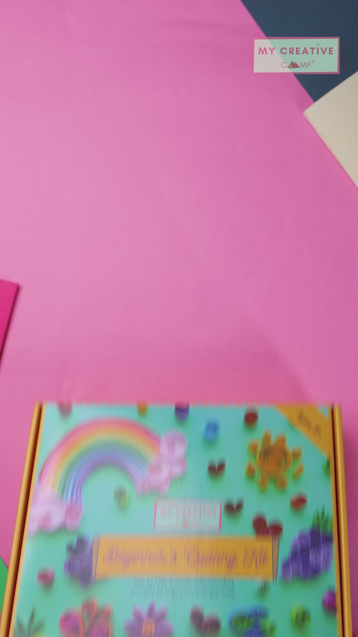 Colorful packaging of a beginner's quilling kit with various quilled designs on a light blue background. Kids, Parents, Party. Kit review and test. 